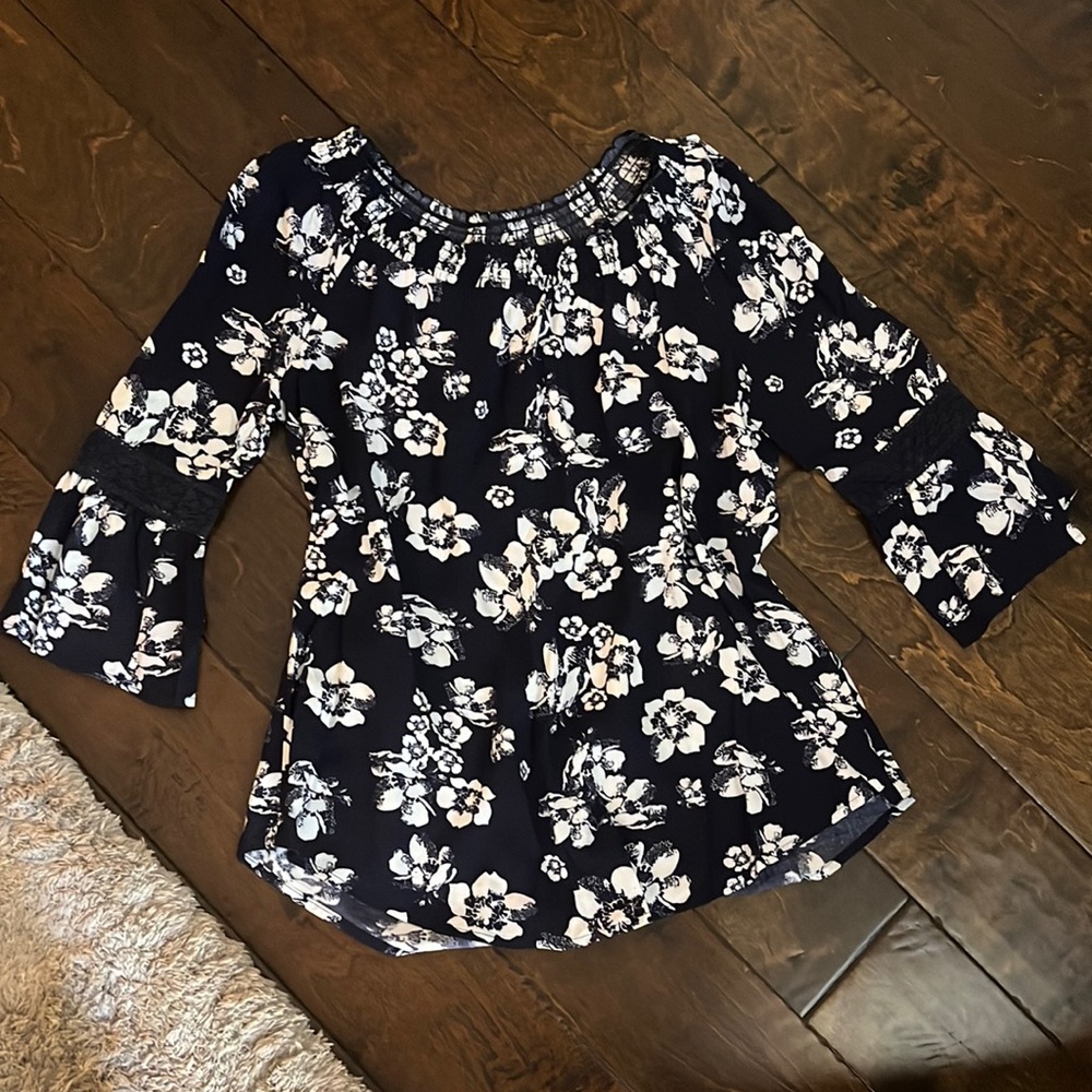 Navy and white blouse can be worn off the shoulder